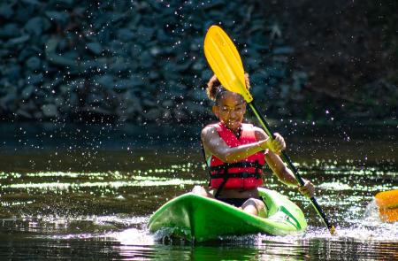 Camper paddling on kayak
