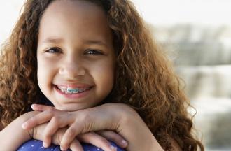 Child smiling with braces