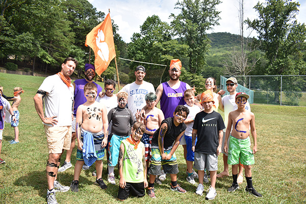 Campers posing with face and body paint