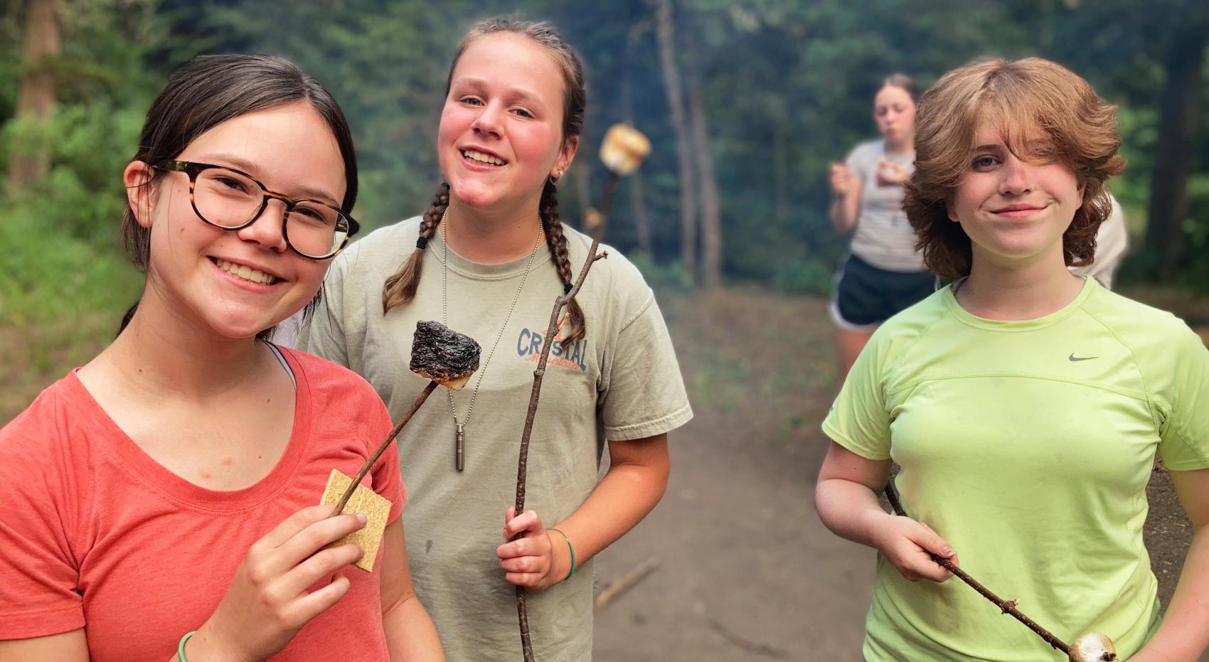campers holding s'mores