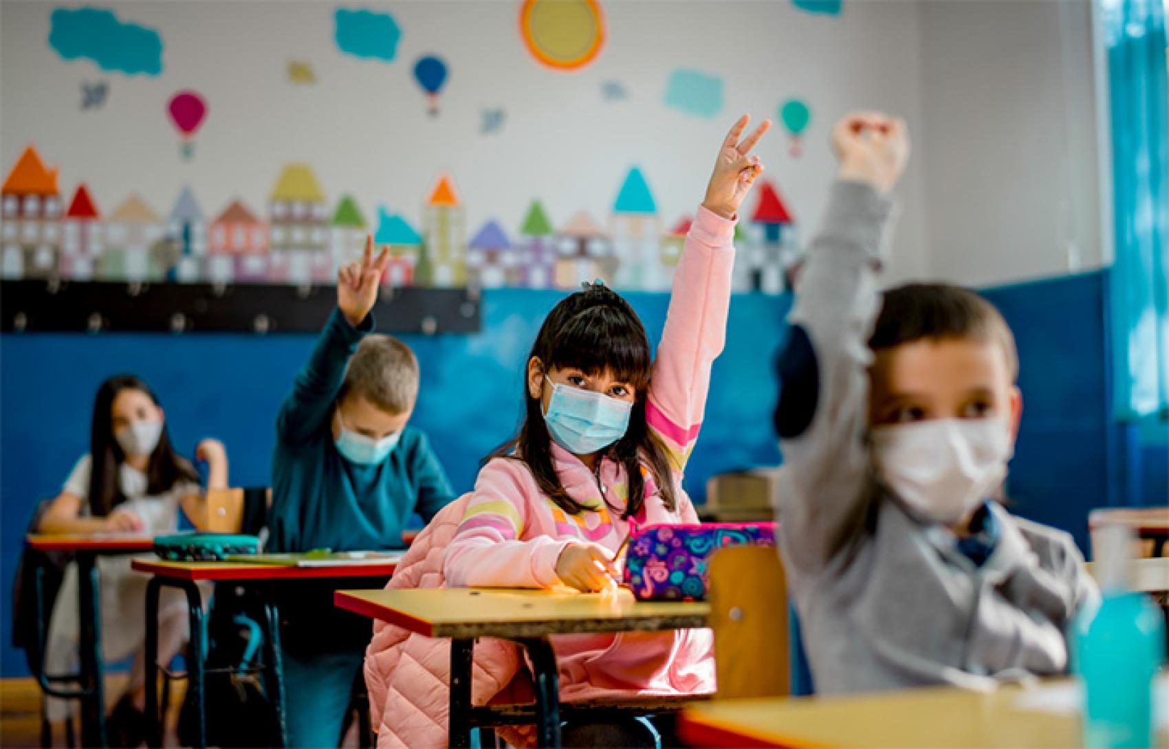 kids wearing masks in a classroom
