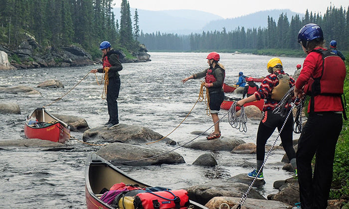 campers with canoes