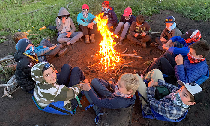 campers around fire