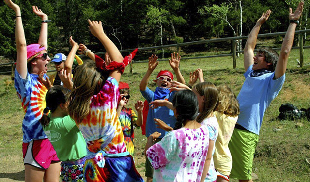 Staff and camper cheering and celebrating