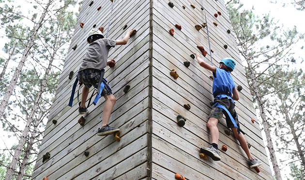 Campers on a climbing wall