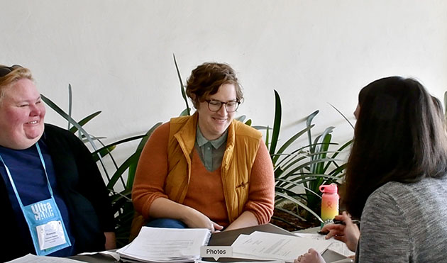 Volunteers talking at a table