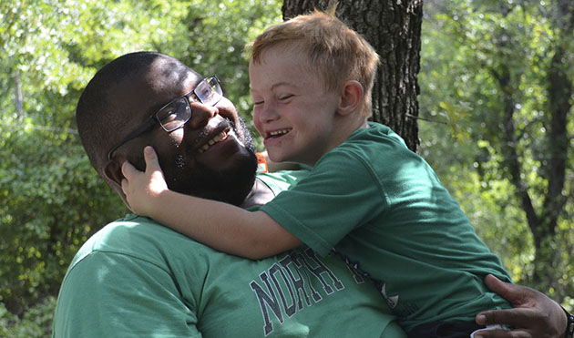 camper and child hugging
