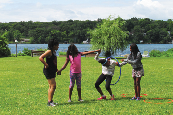 Girls passing hoop