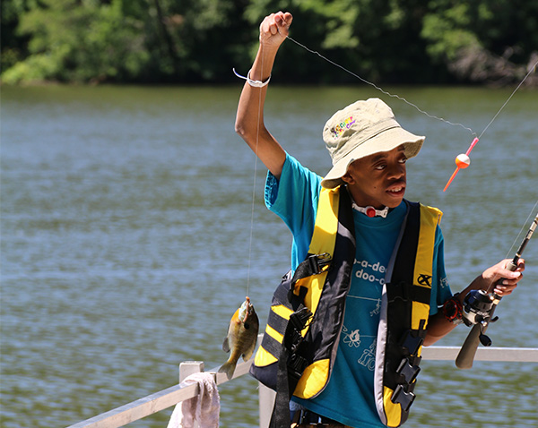 Camper catching a fish