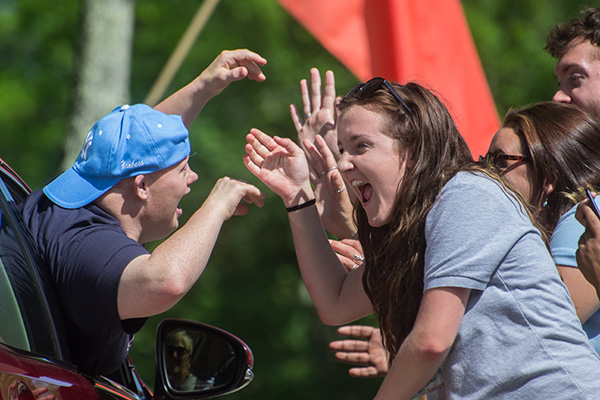 Staff and camper making funny faces