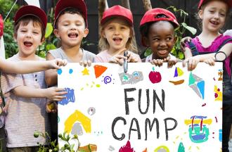 campers with fun camp sign