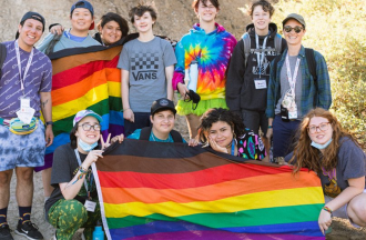 Camp Brave Trails campers with flag