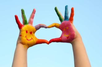 painted hands making heart shape