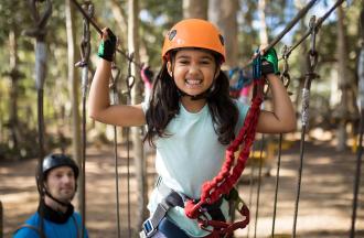 stock photo of girl on ropes course