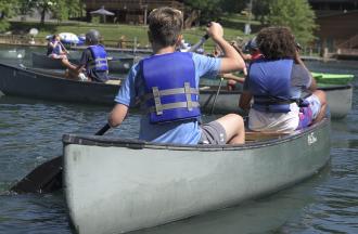 campers canoeing