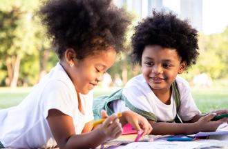 young kids painting in park