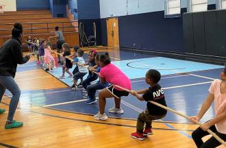 campers in a tug-of-war