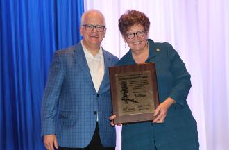 Tom Rosenberg presenting Tish Bolger her award