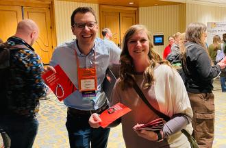 handing out bracelets at National Conference