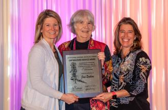 Jane Sanborn receiving the Distinguished Service Award