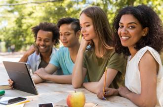 people looking at tablet together