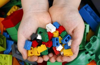 Hand holding legos