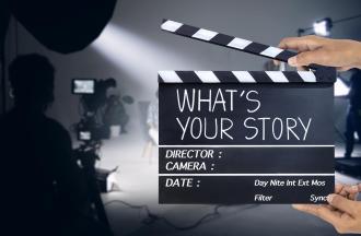 Person holding a clapperboard