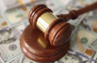 Gavel on dollar bills