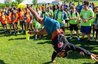 camp staff doing cartwheel