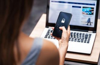 female on phone and computer