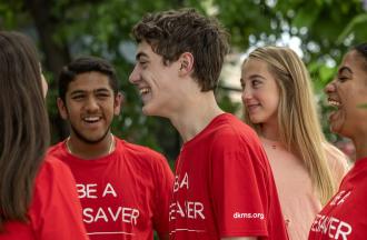 Young adults wearing Be A Lifesaver tshirts