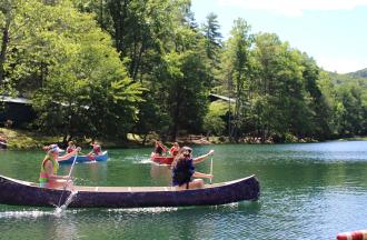campers canoeing