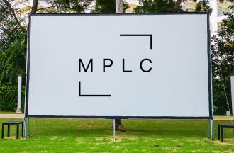 Outdoor movie screen with licensing logo