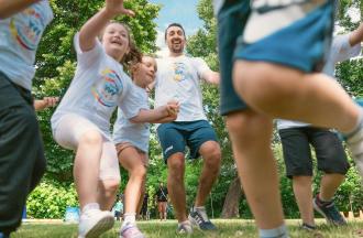 Campers and staff having fun in outdoor activity