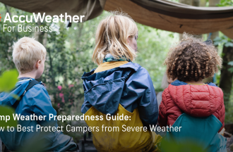 Kids in rain coats looking off into the distance in the woods; Accuweather logo overlayed