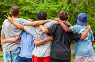 group standing together facing away from camera
