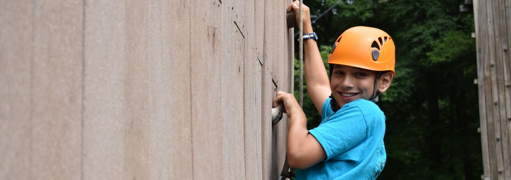 Camper on Climbing Wall