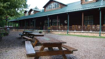 Picture of picnic tables and building at YMCA Camp Manitou-Lin in Michigan
