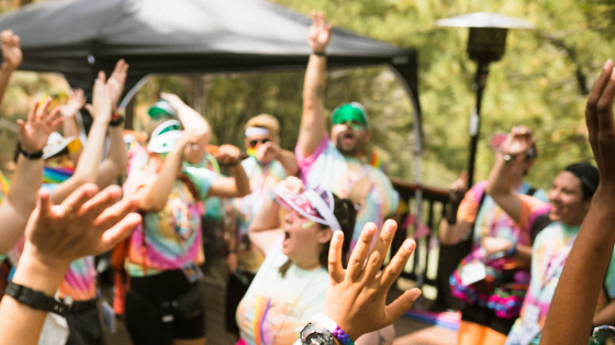 Camp Staff Cheering with Hands Raised