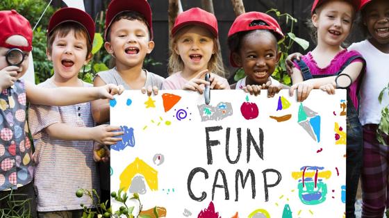 campers with fun camp sign