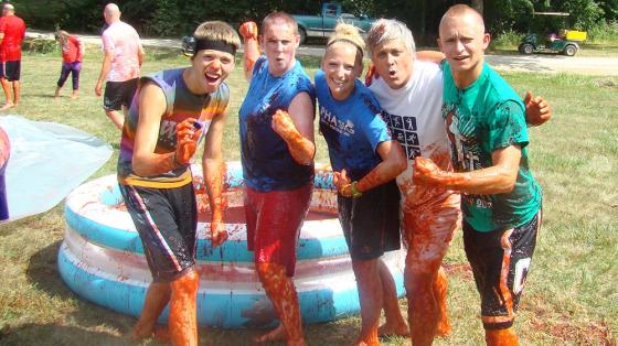 Staff all messy posing for camera