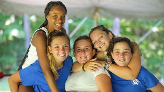 Counselor hugging and posing for photo