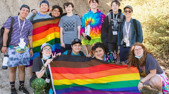 Camp Brave Trails campers with flag