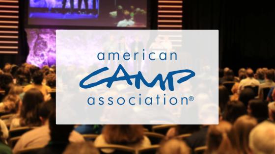 ACA Logo with audience in background
