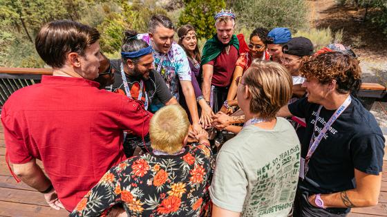 camp staff in huddle