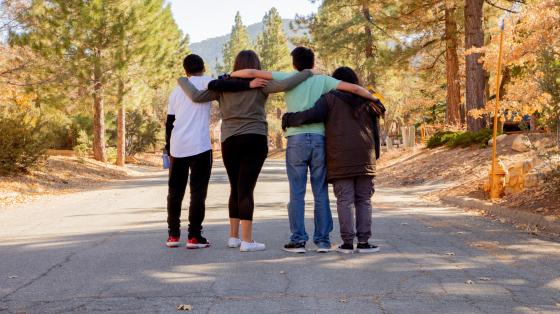 group of teenagers with arms around each other