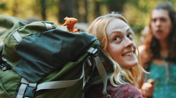 staff with backpack