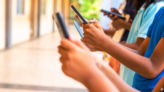 kids hands using smartphone