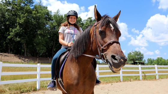 camper riding horse