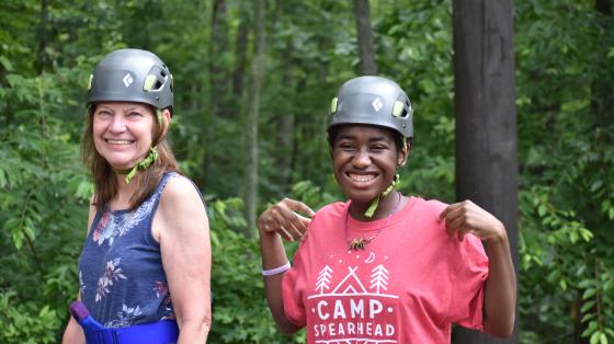 camper and staff wearing helmets